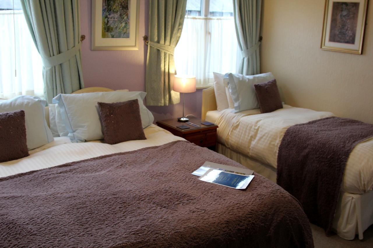 Family room at Kays Cottage with a double bed and a single bed